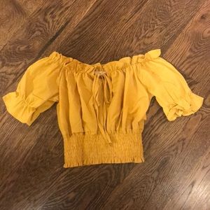 A super cute off the shoulder mustard shirt